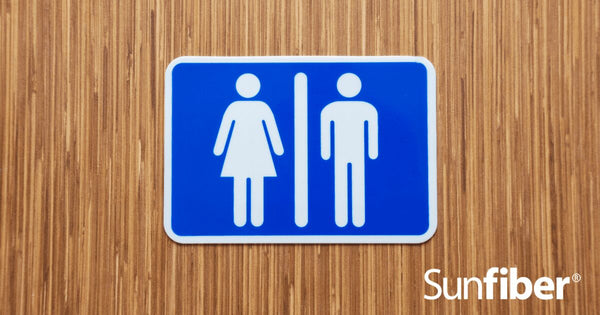 Blue Bathroom sign on wooden door