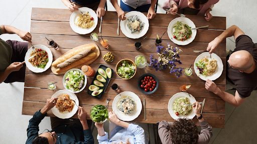 Family sitting around wooden table